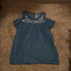 A blue floral shoulder cut shirt